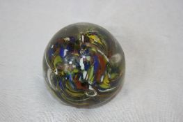 A VICTORIAN HAND CRAFTED PAPER WEIGHT WITH COBALT, RUSSET AND LIME GREEN INCLUSIONS