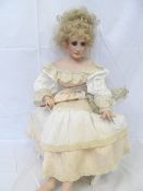 AN ALBERON PORCELAIN DOLL `BETHANY`  WITH PORCELAIN HEAD AND SHOULDERS AND PORCELAIN LOWER ARMS