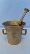 A BRASS VINTAGE PESTLE AND MORTAR