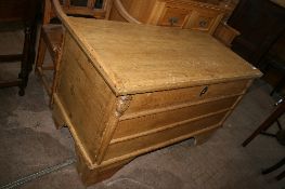 AN ANTIQUE PINE BLANKET CHEST HAVING A CANDLE BOX TO THE INSIDE AND BEING ON BRACKET FEET, APPROX.