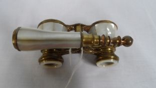 A SET OF MOTHER OF PEARL AND BRASS EDWARDIAN OPERA GLASSES