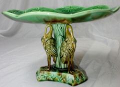 A 19th CENTURY MAJOLICA COMPORT MOULDED IN THE FORM OF A LOTUS PLANT SUPPORTED UPON A STEM OF