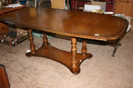 AN OAK EFFECT STAG MADRIGAL DINING TABLE ON FOUR TURNED COLUMN SUPPORTS, APPROX. 190 X 97 X 72 CM