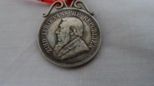 A SOUTH AFRICAN SILVER MEDALLION DEPICTING A RECUMBENT LION, DATED 1813, VRIJHEID BENEATH THE LION