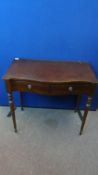 A REPRODUCTION MAHOGANY EFFECT SERPENTINE FRONTED HALL TABLE FITTED WITH TWO DRAWERS ON TURNED LEGS,
