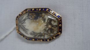 A VICTORIAN ROSE GOLD AND ENAMEL MOURNING BROOCH CONTAINING SEED PEARLS AND PLAITED HAIR