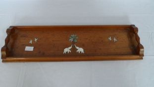 AN ANTIQUE ANGLO INDIAN MAHOGANY AND ROSEWOOD DRINKS TRAY BEING INLAID WITH IVORY  ELEPHANTS AND