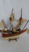 A WOODEN MODEL OF A GALLEON / BRIGANTINE,  APPROX. 60 X 64 CM