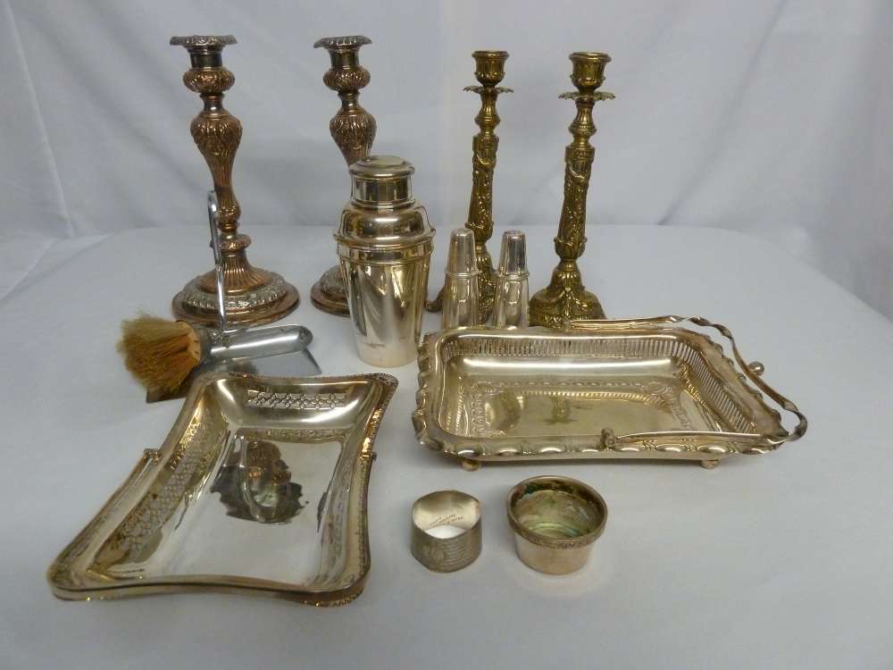 A quantity of silver plate to include candlesticks and fruit baskets