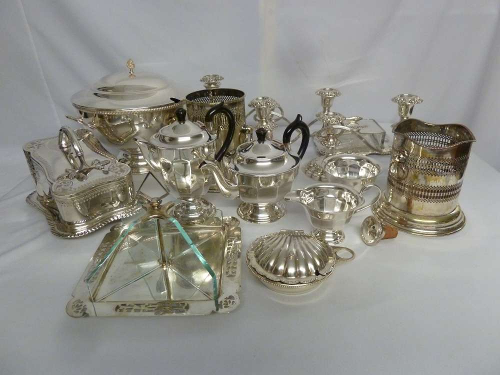 A quantity of silver plate to include two candelabra, a three piece teaset, a cheese stand and