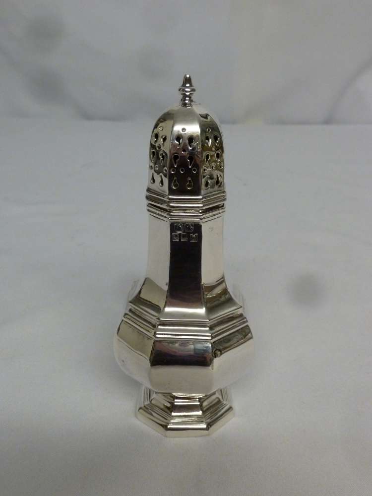 A silver plated sugar sifter of customary form with pull off cover, on shaped raised base