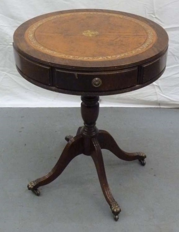 Mahogany reproduction drum table with three drawers, leather top on four outswept feet