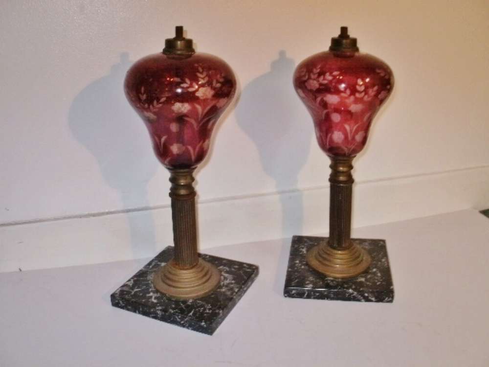 Pair of ruby cut glass garnitures on coloured marble bases