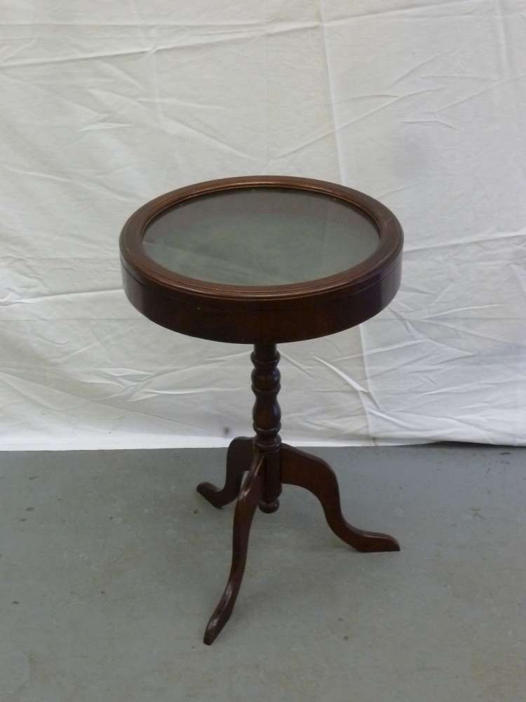 Reproduction mahogany drum table on pedestal base, with pull off cover display case.