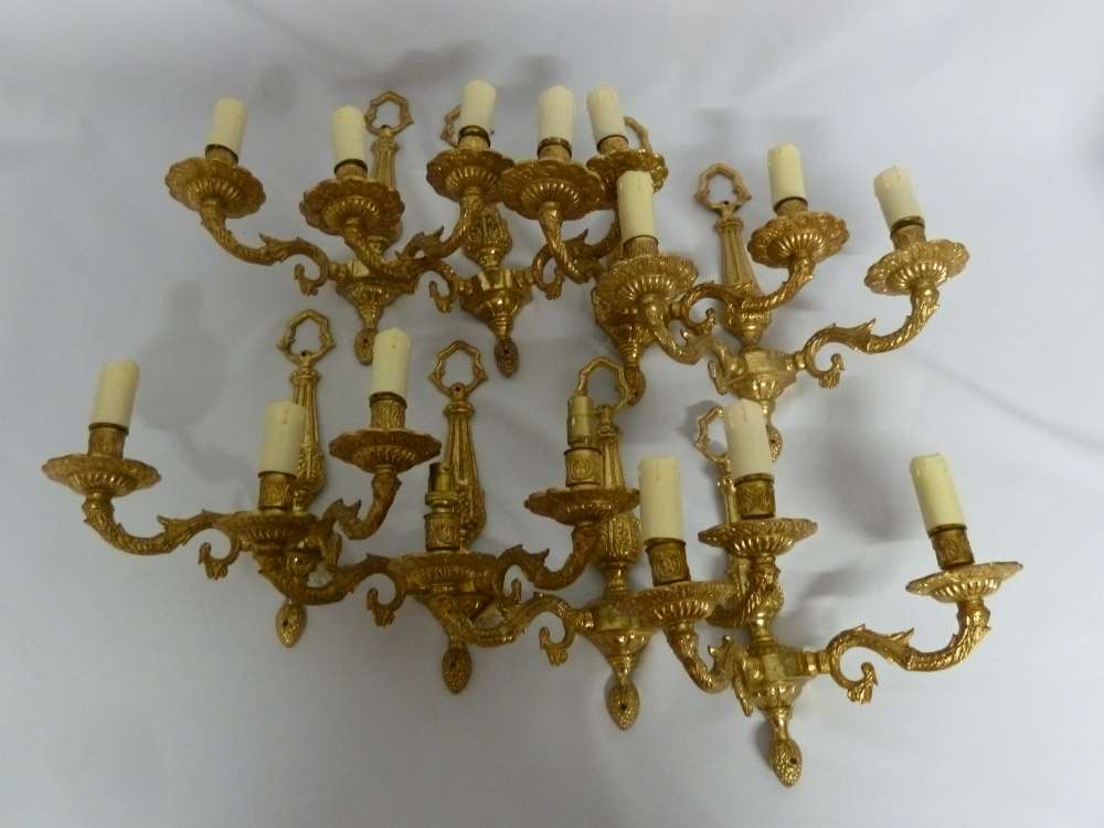 Eight gilt metal wall lights in 18th century style.