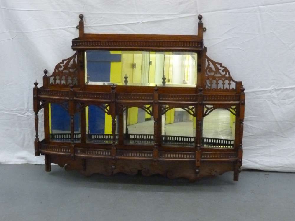 A Victorian mahogany over mantle three tier shelf with mirror back - A/F.