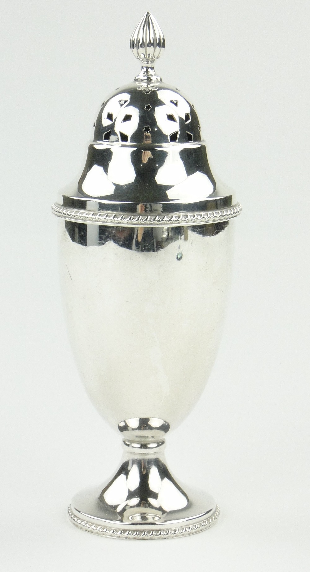 A silver urn shaped sugar caster, Birmingham 1934, height 7.5", 5.5 oz.