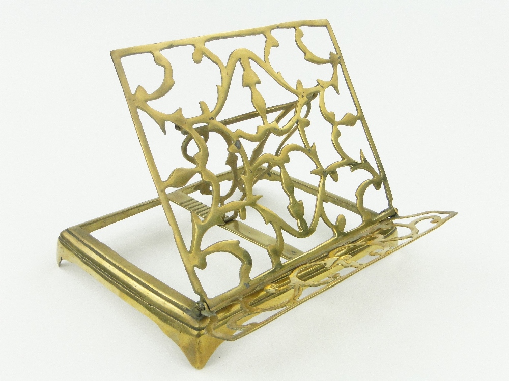 An adjustable brass desk top book stand, length 10.25".