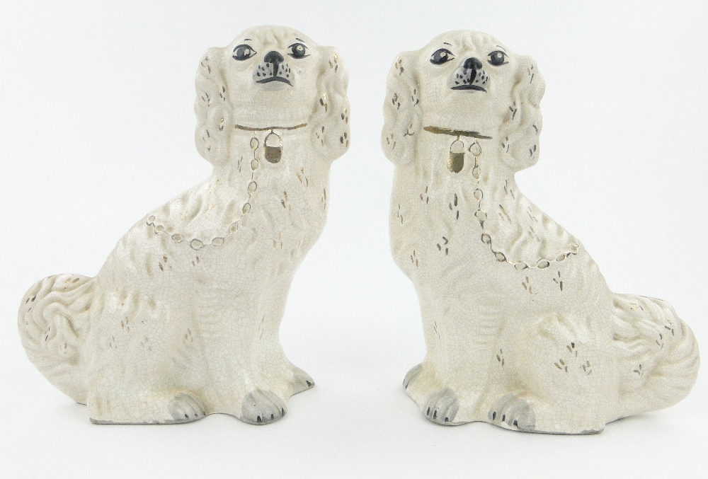 A pair of pottery mantle spaniels, height 12.25".