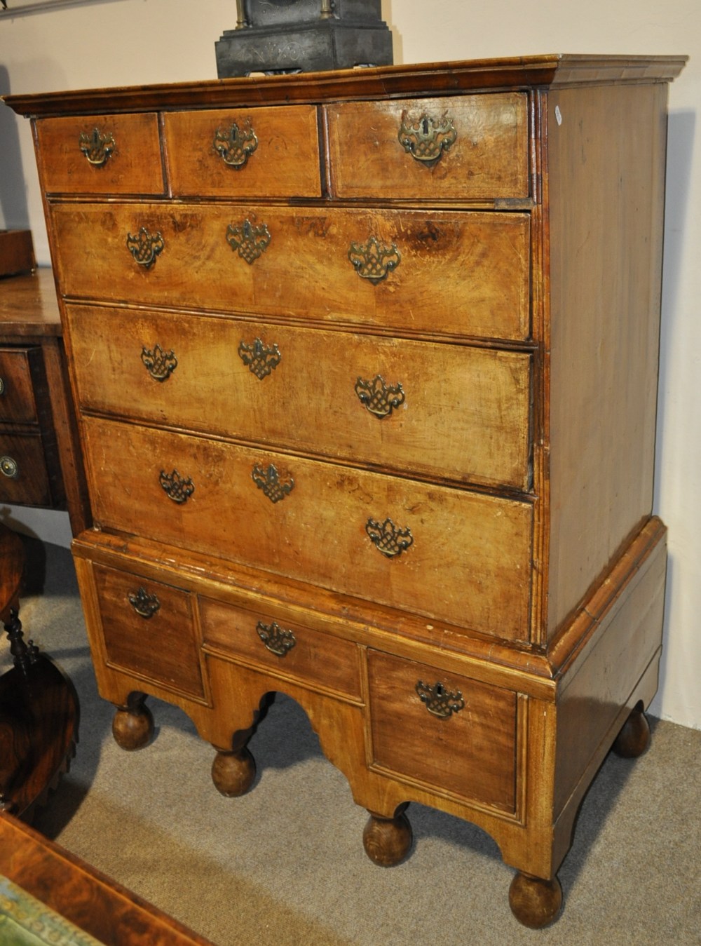 Antique crossbanded walnut chest on stand with 3 short and 3 long drawers, above 3 short drawers,