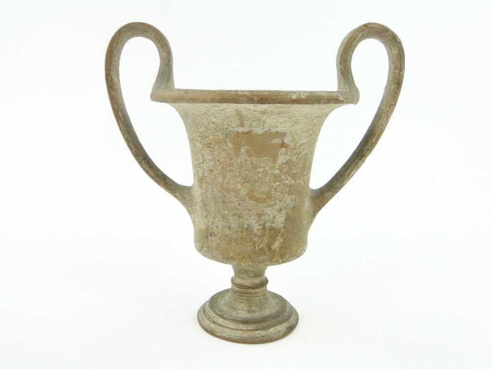 An Ancient Roman pottery 2-handled urn, with inscription on base relating to Pompei, height 5.5".