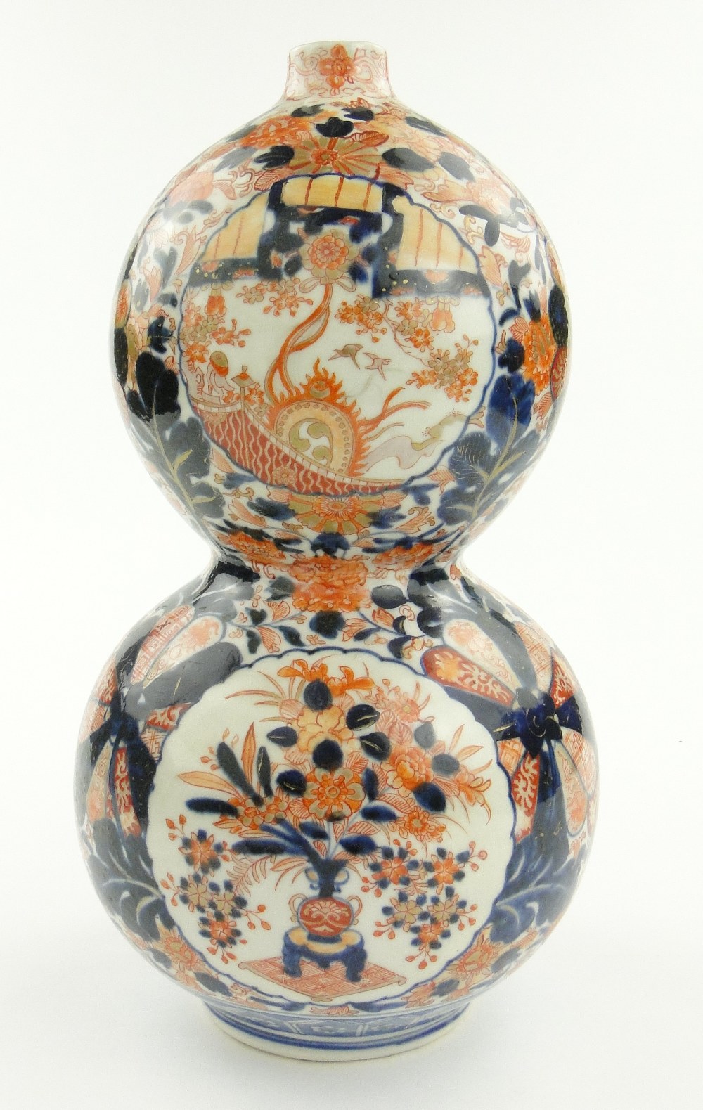 An antique Imari porcelain double gourd vase with painted and gilded floral panels, height 16".