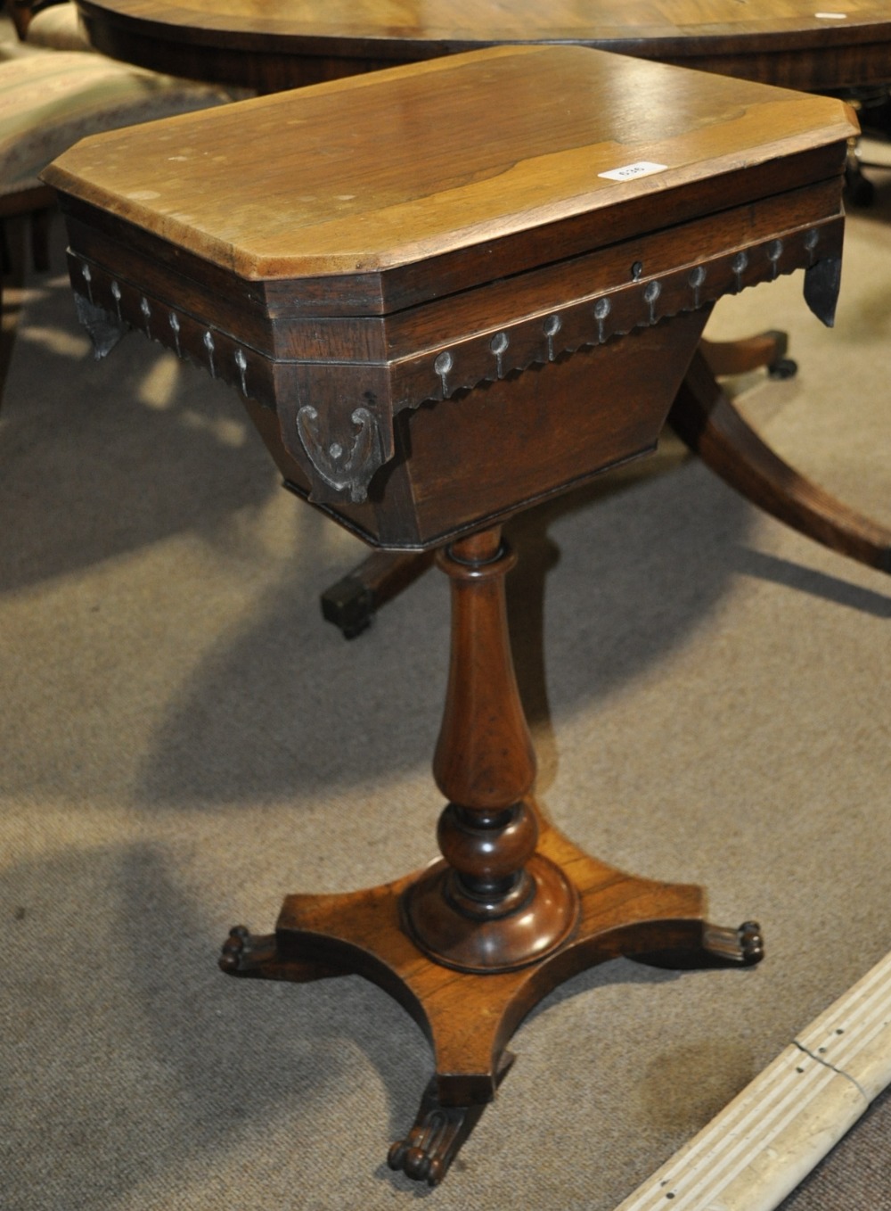 A William IV rosewood sewing table on turned centre column and platform base.