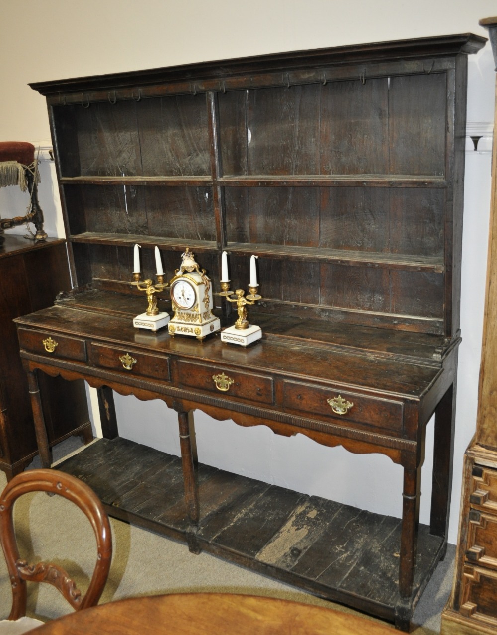 17/18th century joined oak dresser with a boarded open plate rack, 4 frieze drawers and pot board