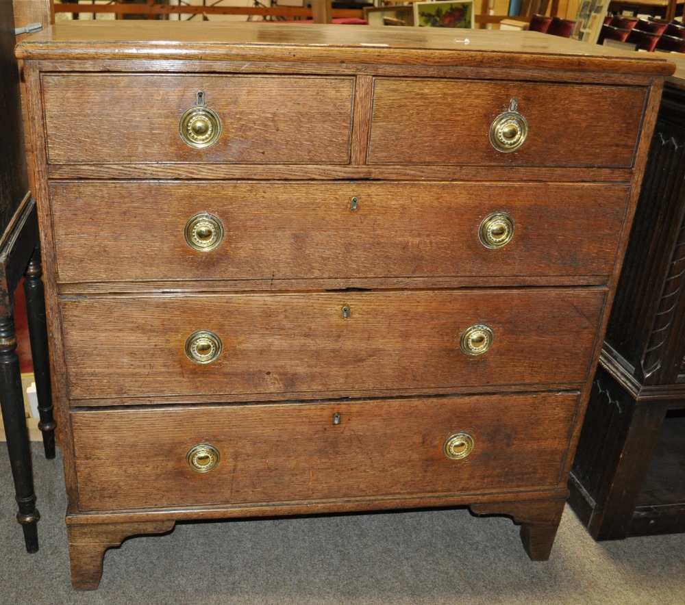 A Georgian oak chest of 2 short and 3 long drawers on bracket feet, width 37".