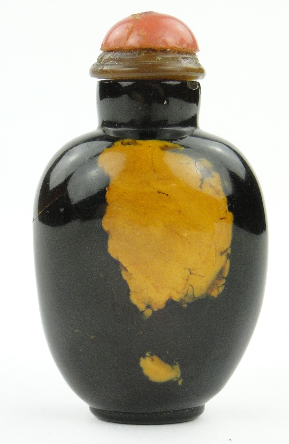 Antique Chinese amber snuff bottle with hardstone stopper, 3".