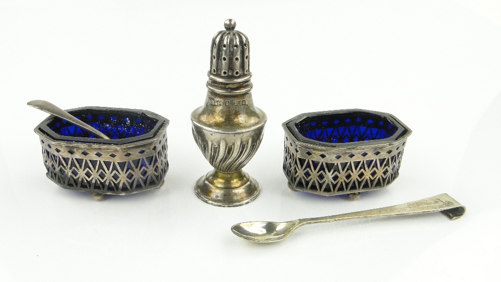 Pair of pierced silver salts with blue glass liners, a small silver pepperette, etc.