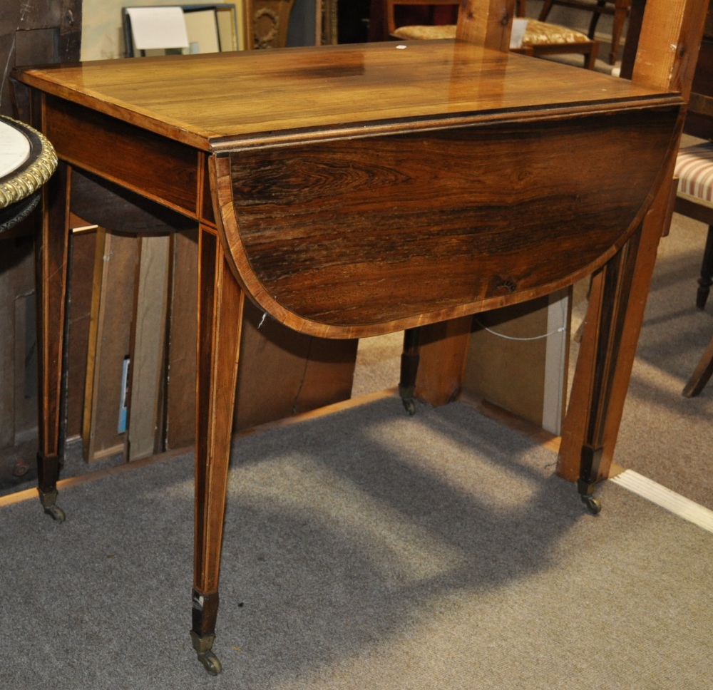 19th century rosewood Pembroke table having satinwood crossbanding raised on square tapered legs,