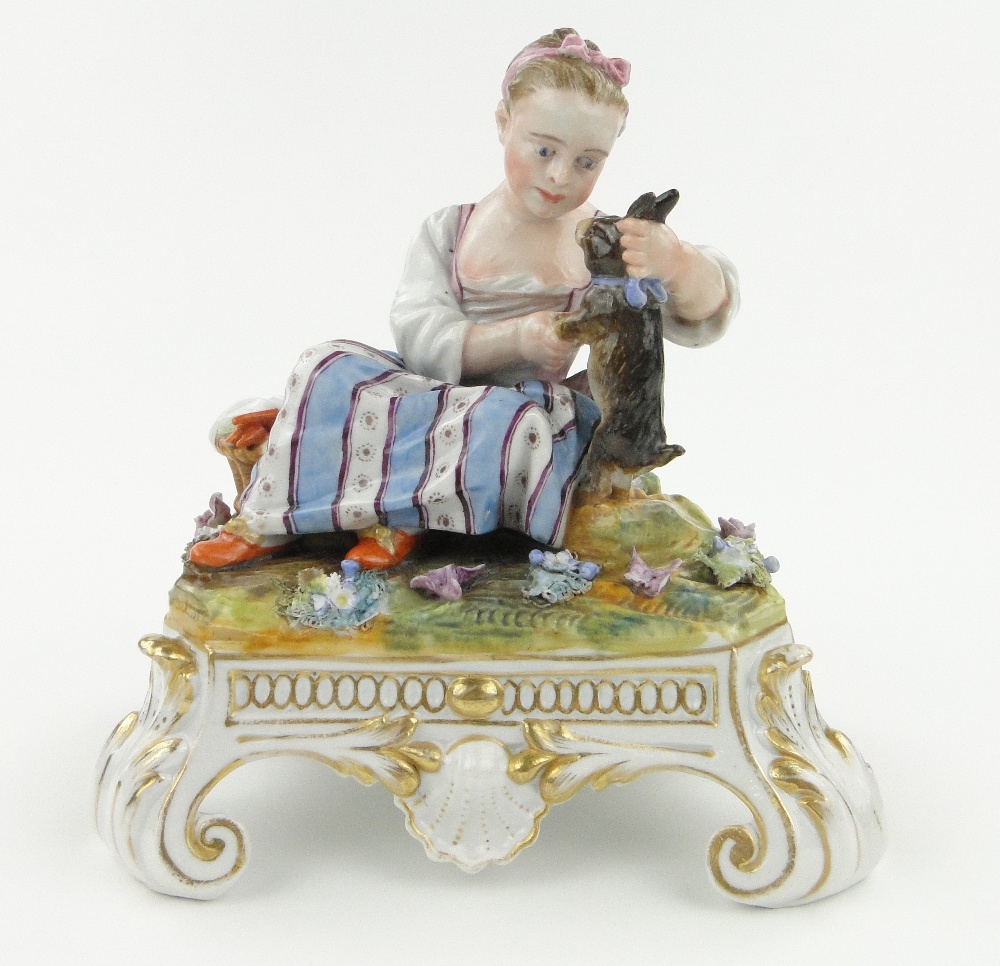 Meissen figure of a girl petting a rabbit on scrolled plinth, height 7".