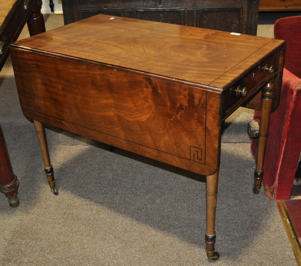 Regency mahogany Pembroke table having allover ebony stringing with end frieze drawer, raised on