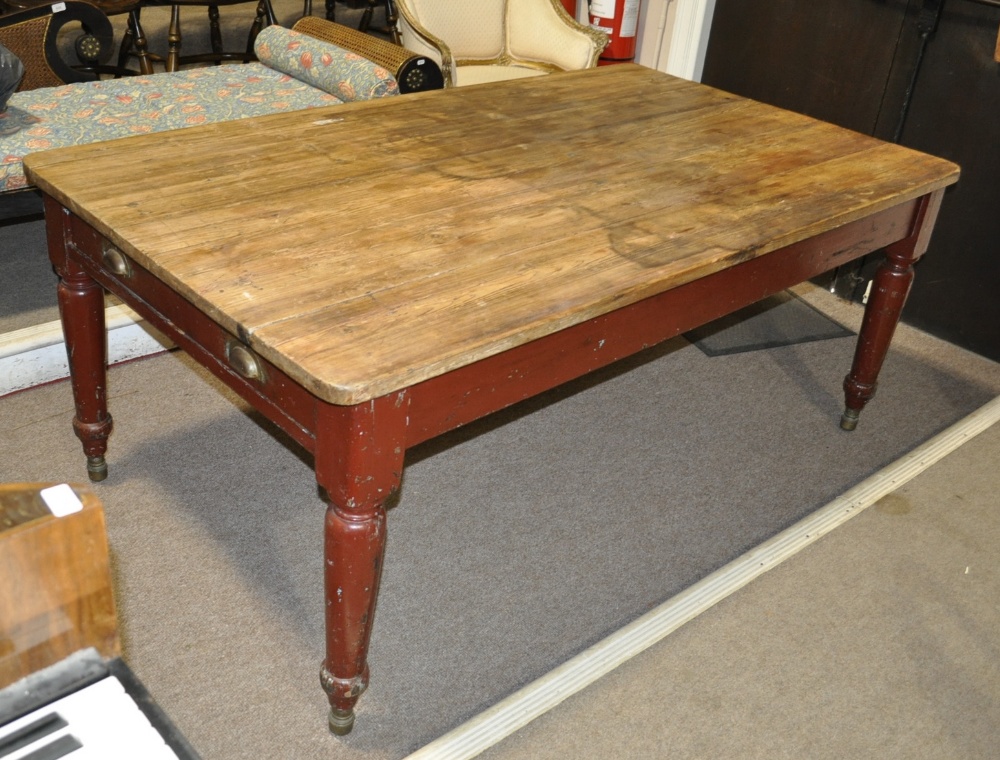 A Victorian pine farmhouse table, with 2 end frieze drawers raised on turned and painted legs.