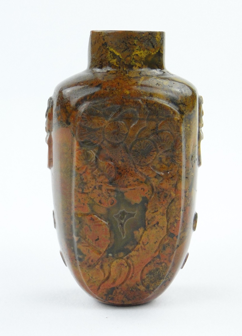 Antique Chinese carved hardstone snuff bottle with panels depicting a pine tree and figure, 2".