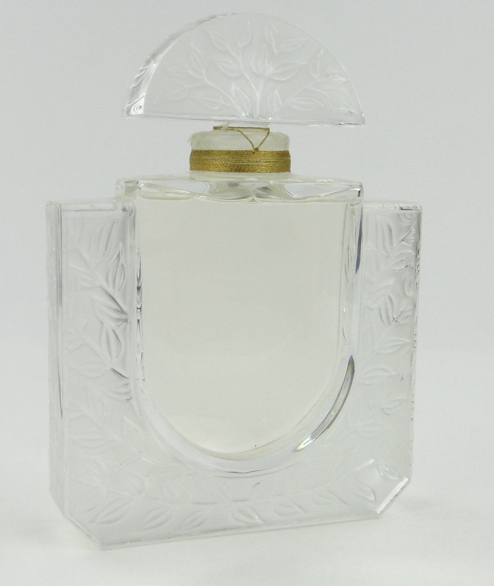 A Lalique glass scent bottle and stopper with moulded and frosted foliate design, height 10.25".