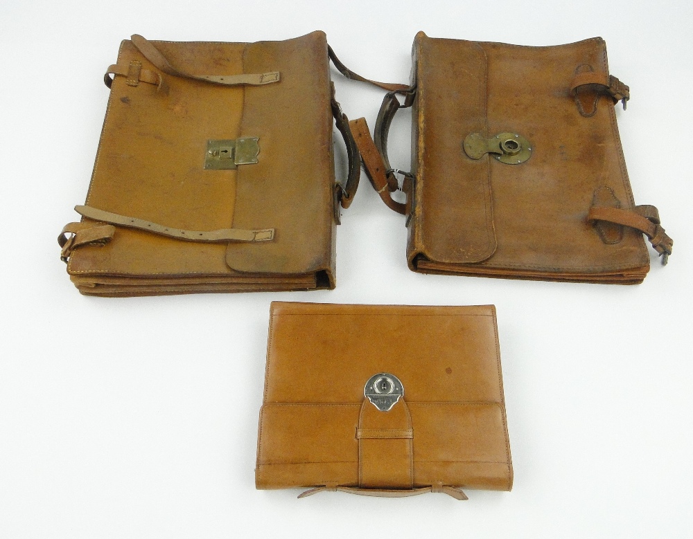 2 Leather music cases with brass mounts and a leather stationery wallet, 9.75".