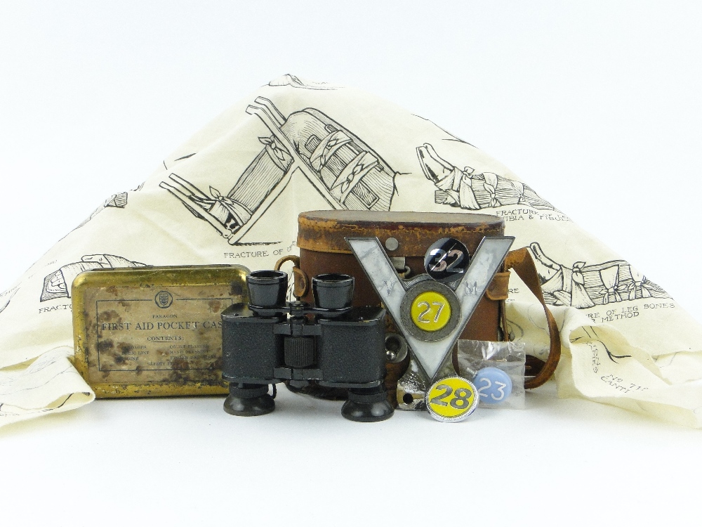 A First Aid box and a handkerchief bandage, binoculars, veteran motorists badge, etc.