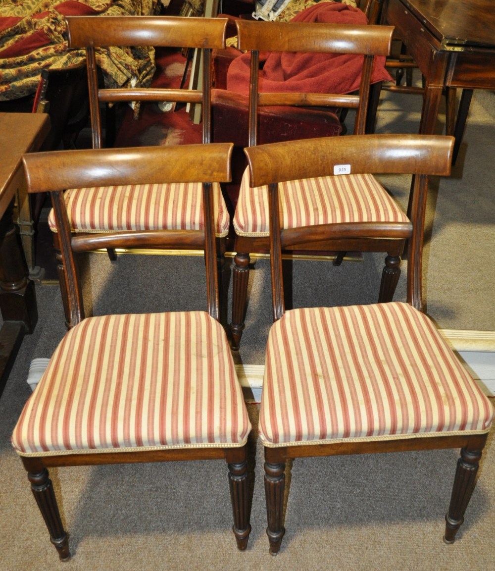 Set of 4 William IV mahogany dining chairs with upholstered seats and reeded legs.