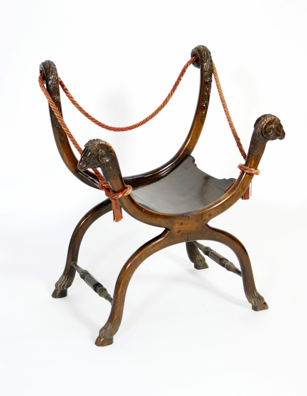 Italian carved walnut Savonarola chair, late 19th Century, the U-shaped seat with carved rams head