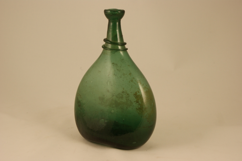 Continental green glass bottle, 19th Century or earlier, flattened ovoid form with applied serpent