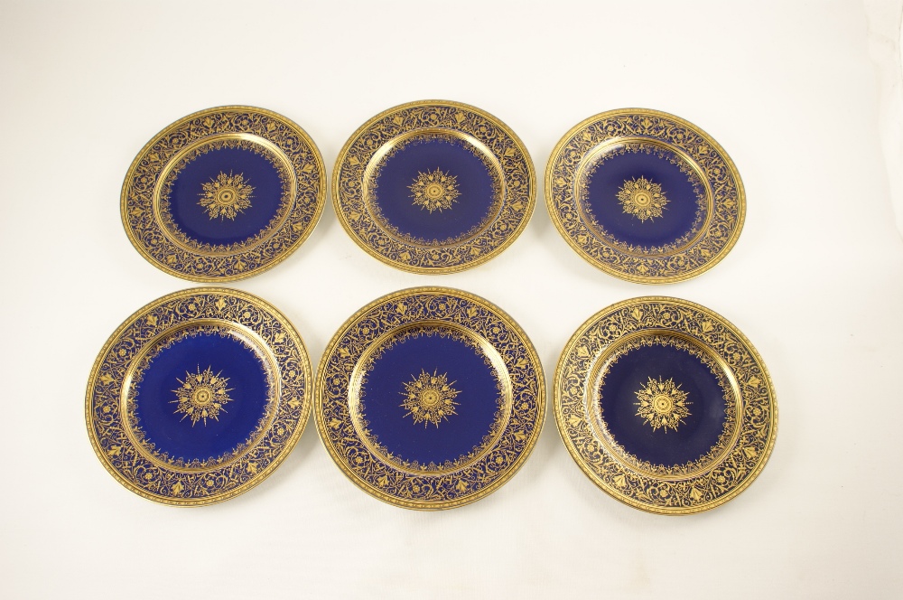 Set of six quality gilded blue glazed dessert plates, possibly Limoges, circa 1910, the borders