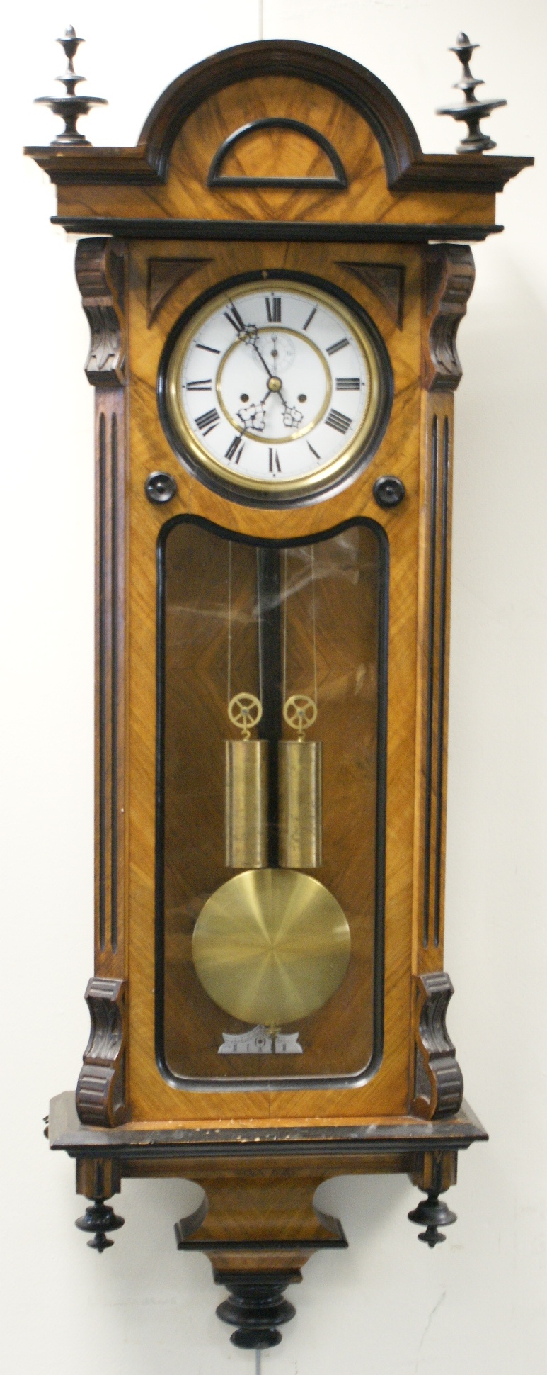 Victorian walnut and ebonised Vienna regulator wall clock, circa 1890, with turned finials over an