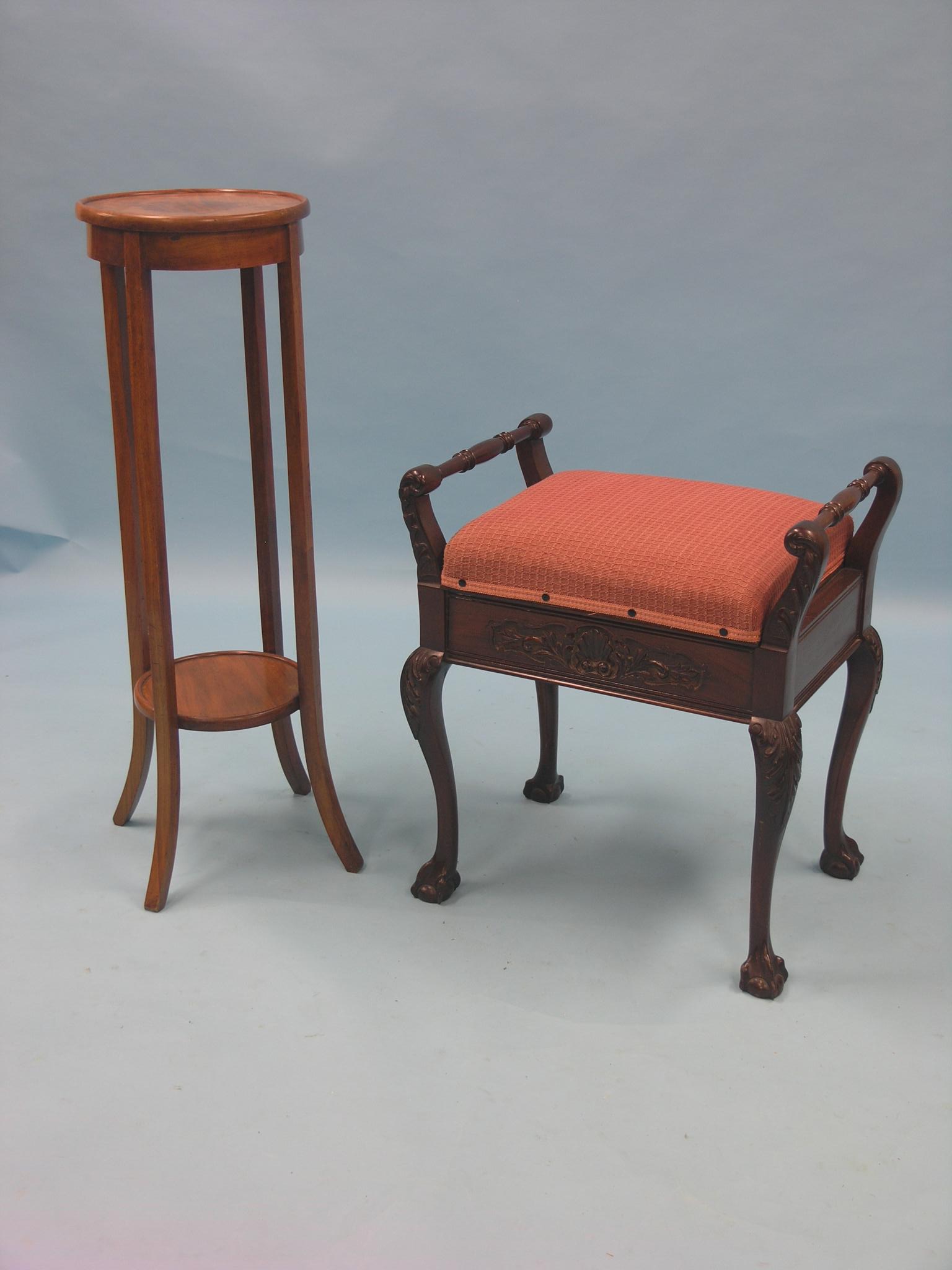 An early 20th century mahogany piano stool, with carved detail, on cabriole legs, together with an