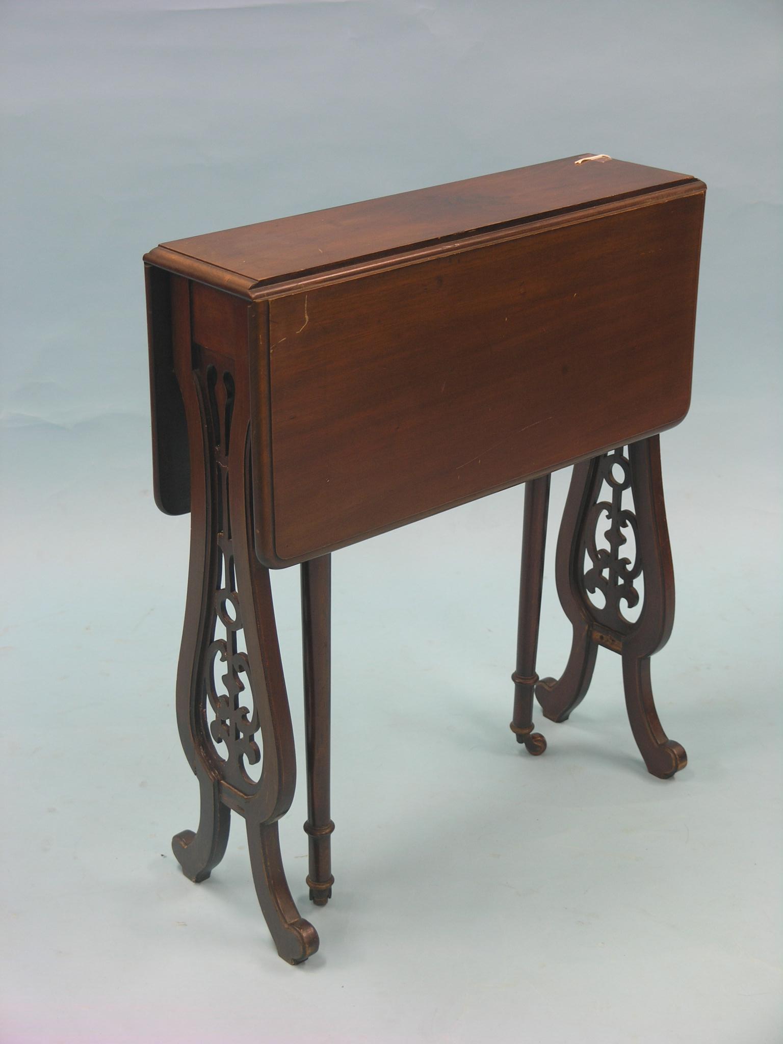 A Victorian mahogany Sutherland table, on pierced lyre-shape end supports, 2ft.