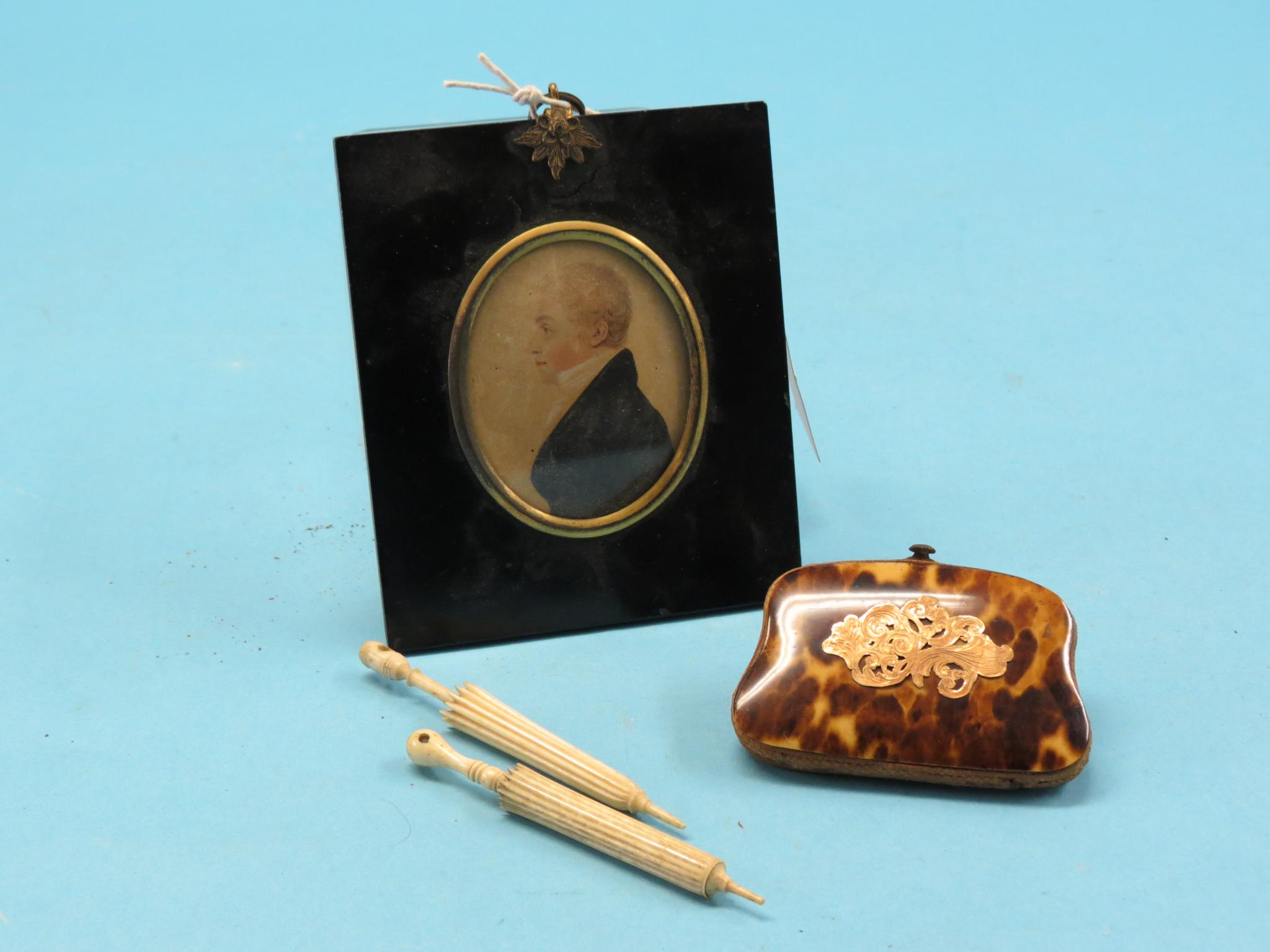 A Victorian tortoiseshell purse, with engraved gold mount, 3.25in., together with two Victorian bone