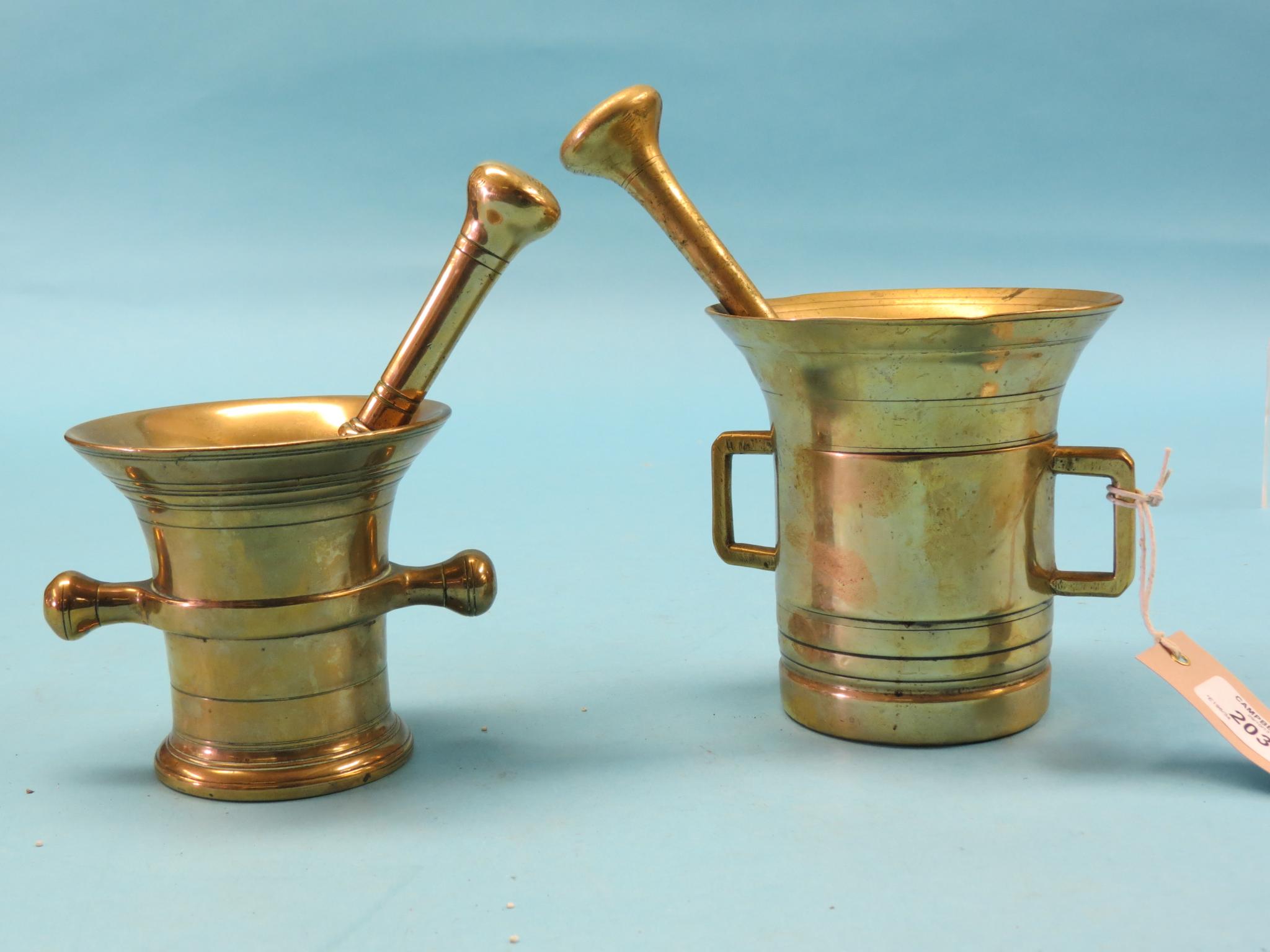 Two 19th century bronze mortars, each twin-handled with pestle