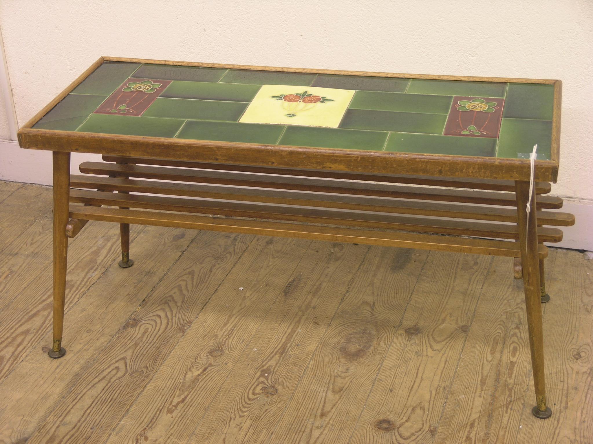 A coffee table, rectangular top inset with Art Nouveau ceramic tiles