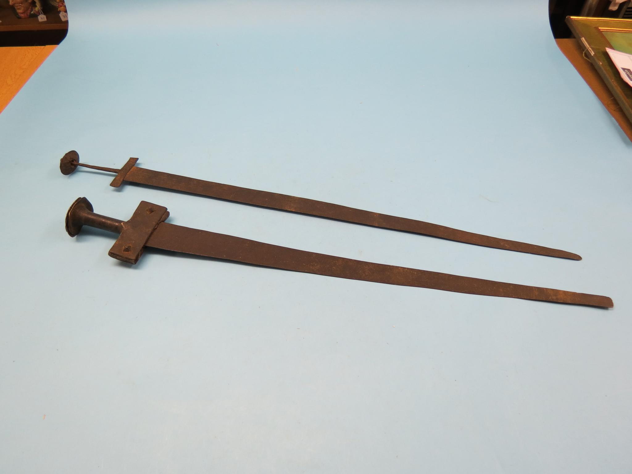 Two Sudanese iron swords, 31in. and 28in. blades, circa 1880